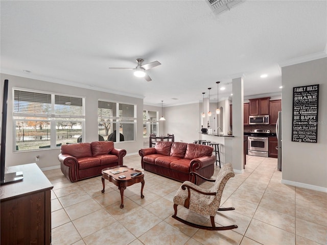 tiled living room featuring ceiling fan and ornamental molding