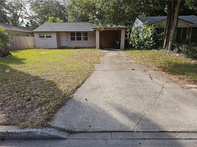 single story home featuring a front lawn