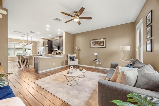 living room with ceiling fan