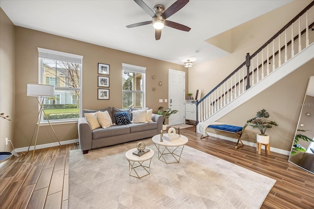 living room with wood-type flooring and ceiling fan