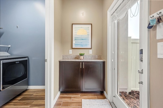 laundry area with cabinets