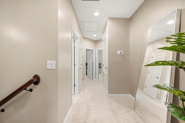 corridor with light colored carpet