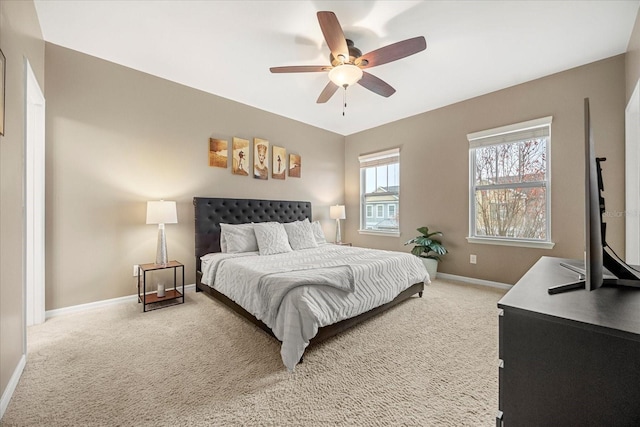 bedroom with ceiling fan and carpet