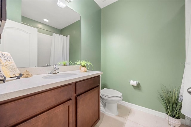 bathroom featuring a shower with shower curtain, vanity, toilet, and tile patterned flooring