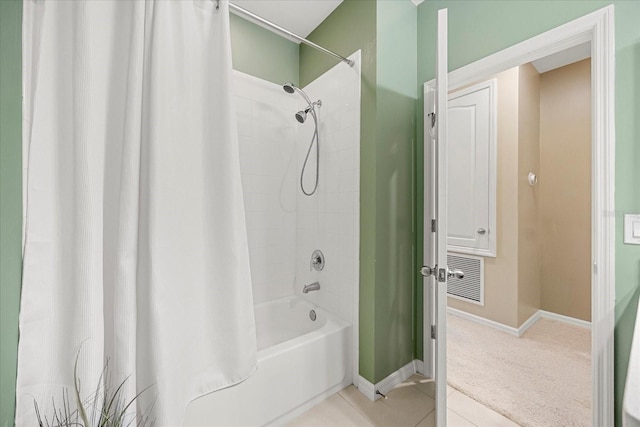 bathroom featuring tile patterned flooring and shower / bath combo with shower curtain