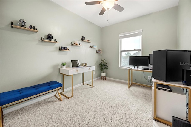 carpeted office featuring ceiling fan