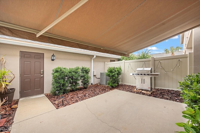 view of patio / terrace with grilling area and central air condition unit