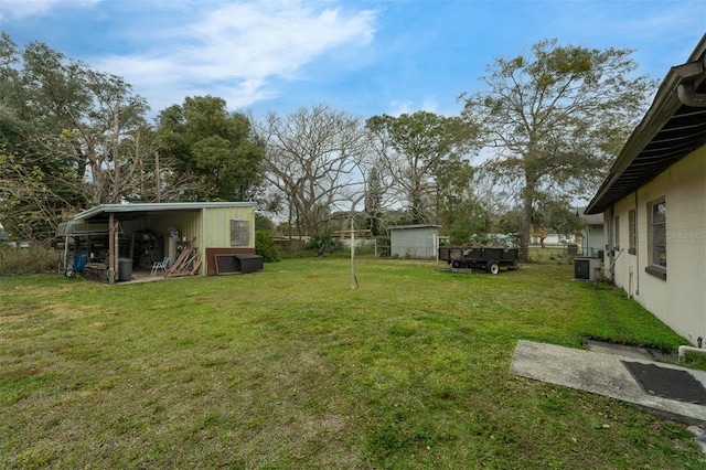 view of yard featuring an outbuilding and cooling unit