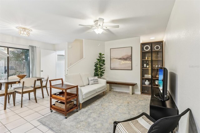 living room with light tile patterned floors and ceiling fan