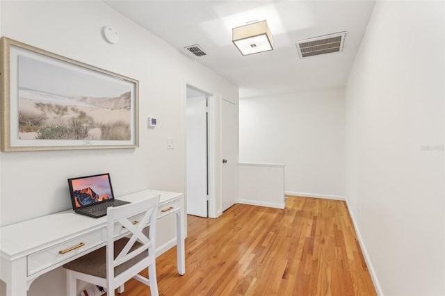 office space with light hardwood / wood-style floors