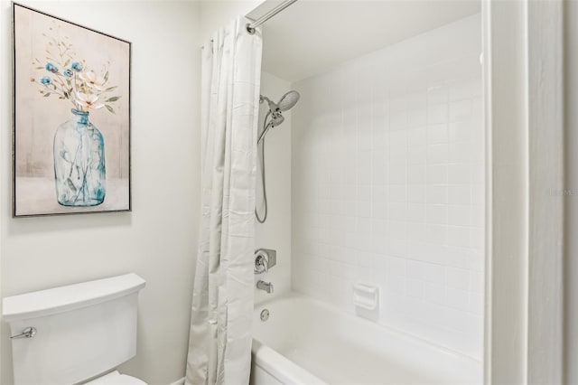 bathroom featuring toilet and shower / bath combo