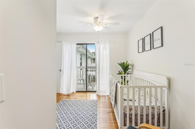 bedroom featuring access to outside, ceiling fan, and light hardwood / wood-style flooring