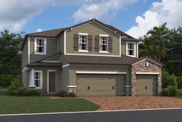 view of front facade with a garage and a front yard