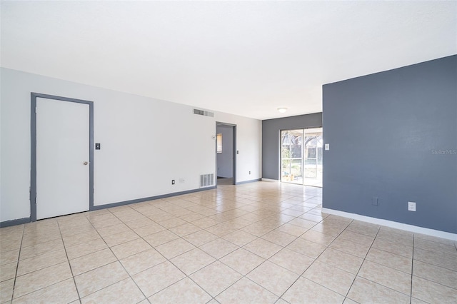 empty room with light tile patterned flooring