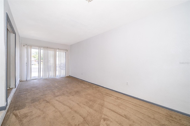 unfurnished room with carpet flooring