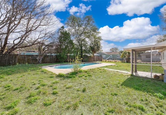 view of yard with a fenced in pool