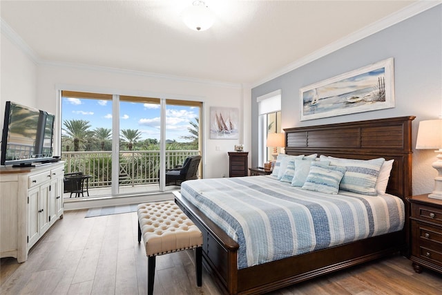 bedroom featuring light hardwood / wood-style flooring, access to outside, and ornamental molding