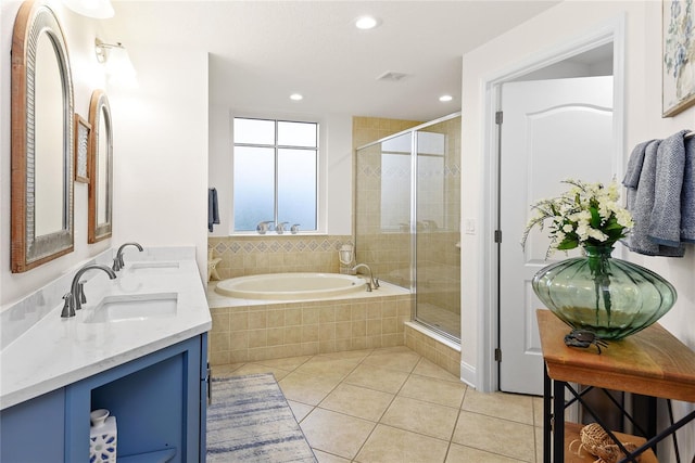 bathroom featuring vanity, tile patterned floors, and shower with separate bathtub