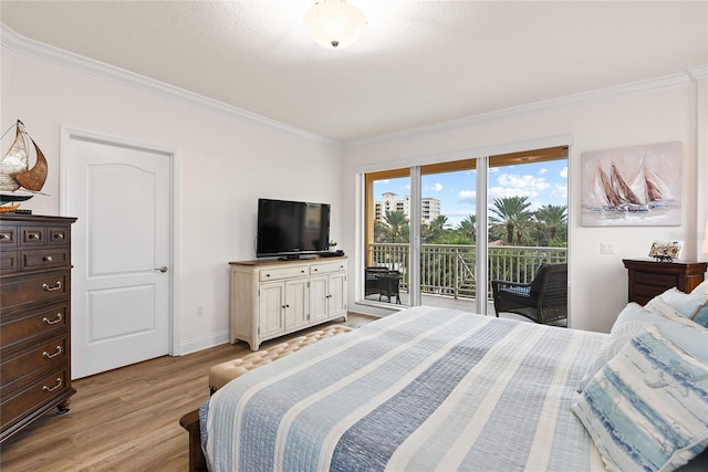 bedroom with crown molding, access to outside, and light wood-type flooring