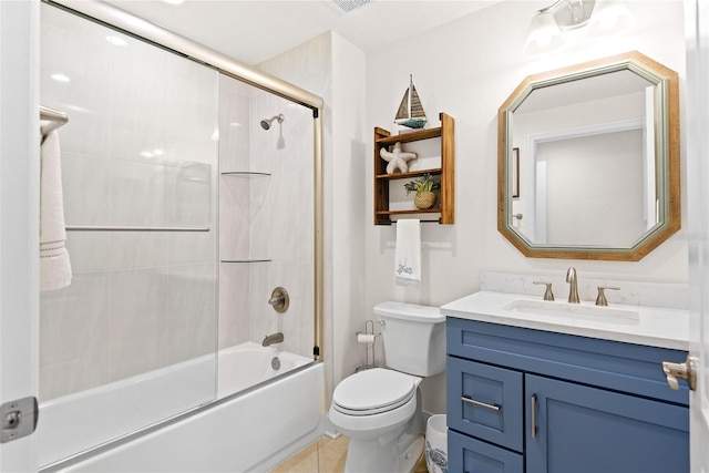 full bathroom with enclosed tub / shower combo, vanity, toilet, and tile patterned flooring