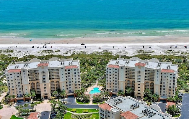 bird's eye view featuring a beach view and a water view