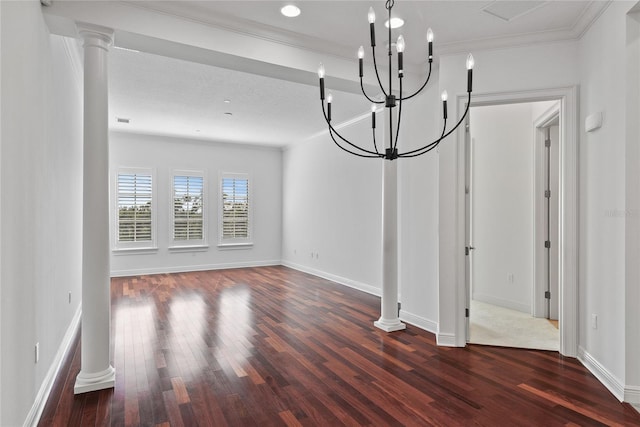 unfurnished dining area featuring ornamental molding, dark hardwood / wood-style flooring, and decorative columns