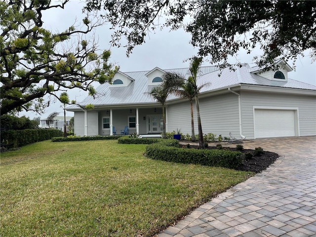 view of front facade with a garage and a front lawn