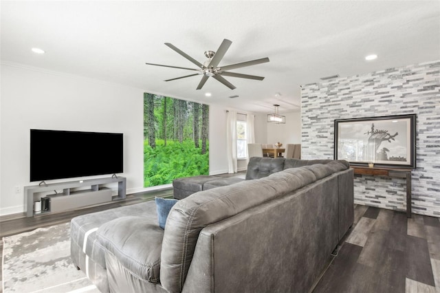 living area with baseboards, a ceiling fan, dark wood-style flooring, and recessed lighting