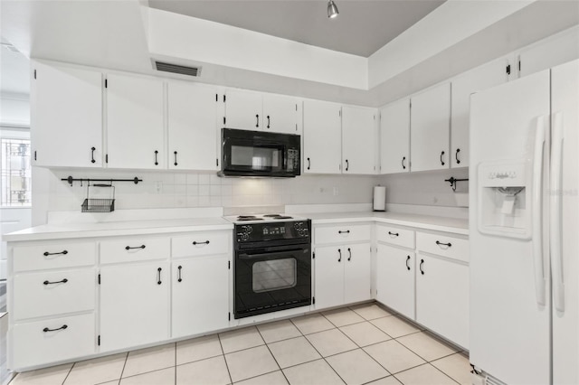 kitchen with decorative backsplash, light countertops, visible vents, and black appliances