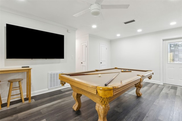 rec room with ornamental molding, visible vents, baseboards, and wood finished floors