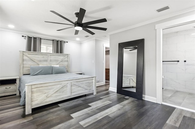 bedroom with visible vents, crown molding, baseboards, and wood finished floors