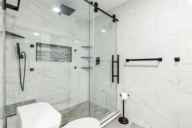 full bathroom featuring a shower stall and toilet