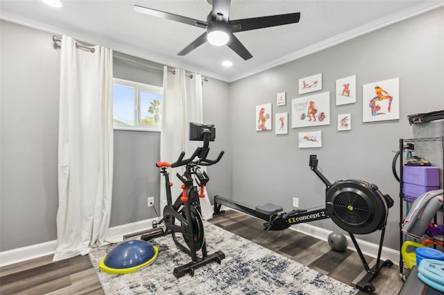 exercise room featuring recessed lighting, crown molding, baseboards, and wood finished floors