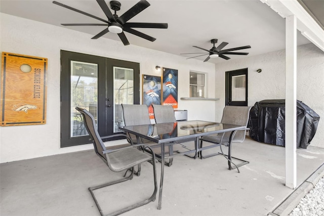 view of patio with a ceiling fan, outdoor dining space, and a grill