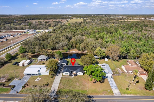 bird's eye view featuring a forest view