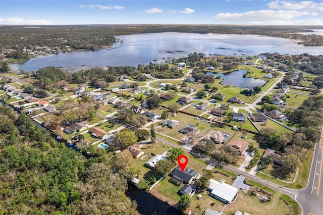 birds eye view of property with a residential view and a water view