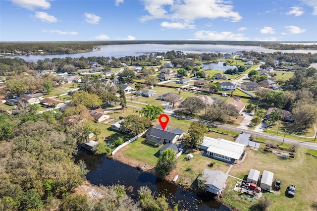 birds eye view of property featuring a residential view and a water view