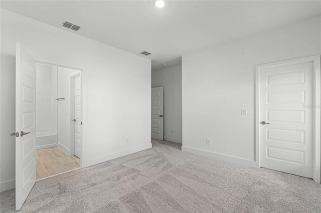 unfurnished bedroom with light carpet