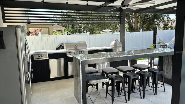 526 First Cape Coral Dr, Winter Garden, FL 34787 - view of patio / terrace featuring area for grilling, a pergola, ceiling fan, a grill, and exterior bar