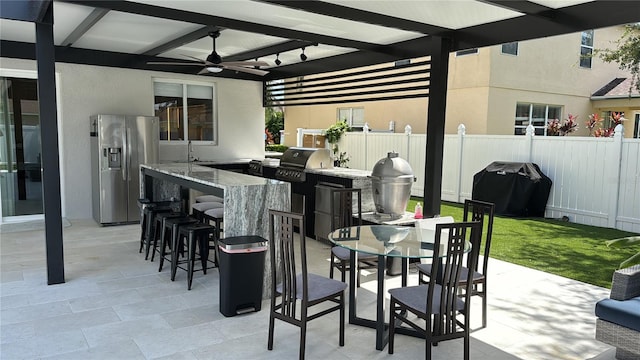 526 First Cape Coral Dr, Winter Garden, FL 34787 - view of patio / terrace with a grill, an outdoor kitchen, an outdoor wet bar, and ceiling fan
