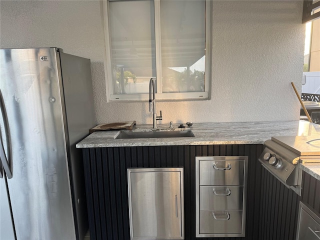 526 First Cape Coral Dr, Winter Garden, FL 34787 - kitchen featuring stainless steel fridge and sink