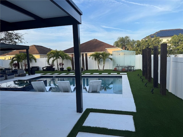 view of swimming pool featuring a patio area and a lawn