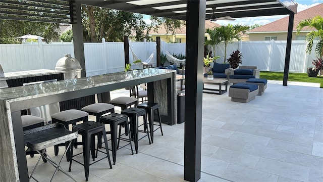 526 First Cape Coral Dr, Winter Garden, FL 34787 - view of patio / terrace featuring a bar, a pergola, and exterior kitchen