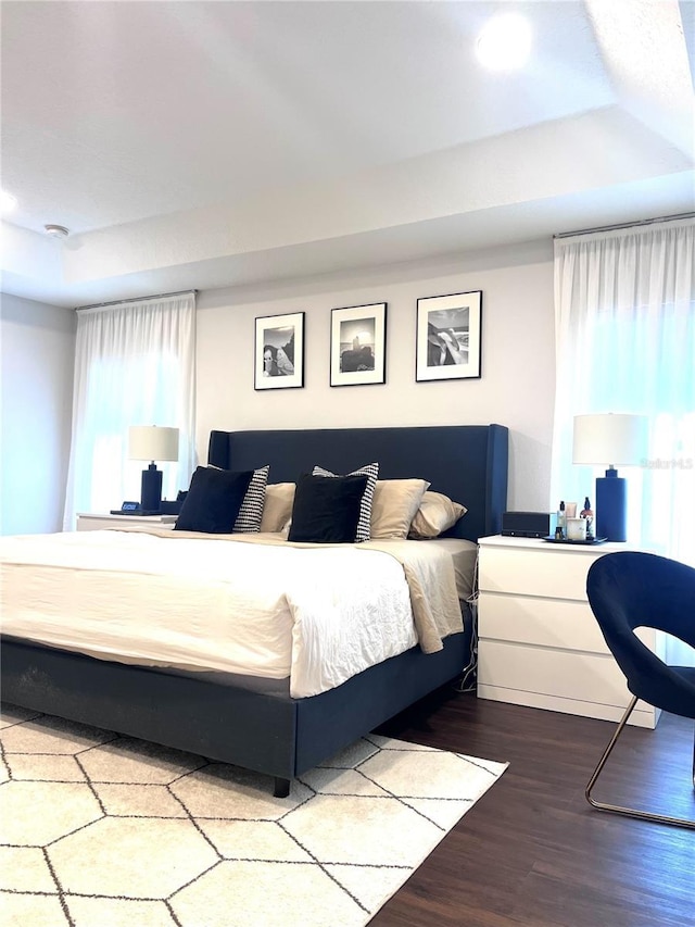 526 First Cape Coral Dr, Winter Garden, FL 34787 - bedroom featuring wood-type flooring and a tray ceiling