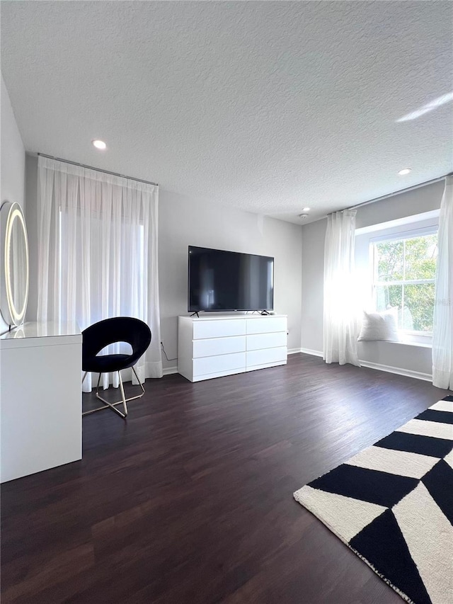 526 First Cape Coral Dr, Winter Garden, FL 34787 - unfurnished living room with dark hardwood / wood-style floors and a textured ceiling