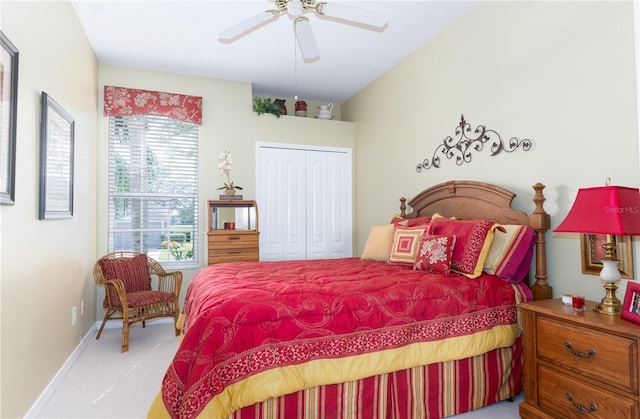 carpeted bedroom with a closet and ceiling fan