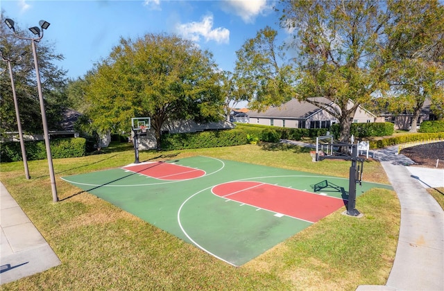 view of basketball court featuring a yard