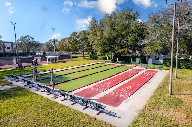 view of community featuring a yard