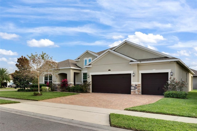 view of front facade with a garage and a front lawn