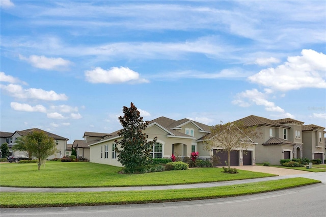 view of front of property with a garage and a front yard